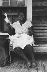 Letha Weston on her porch with one of her grandchildren